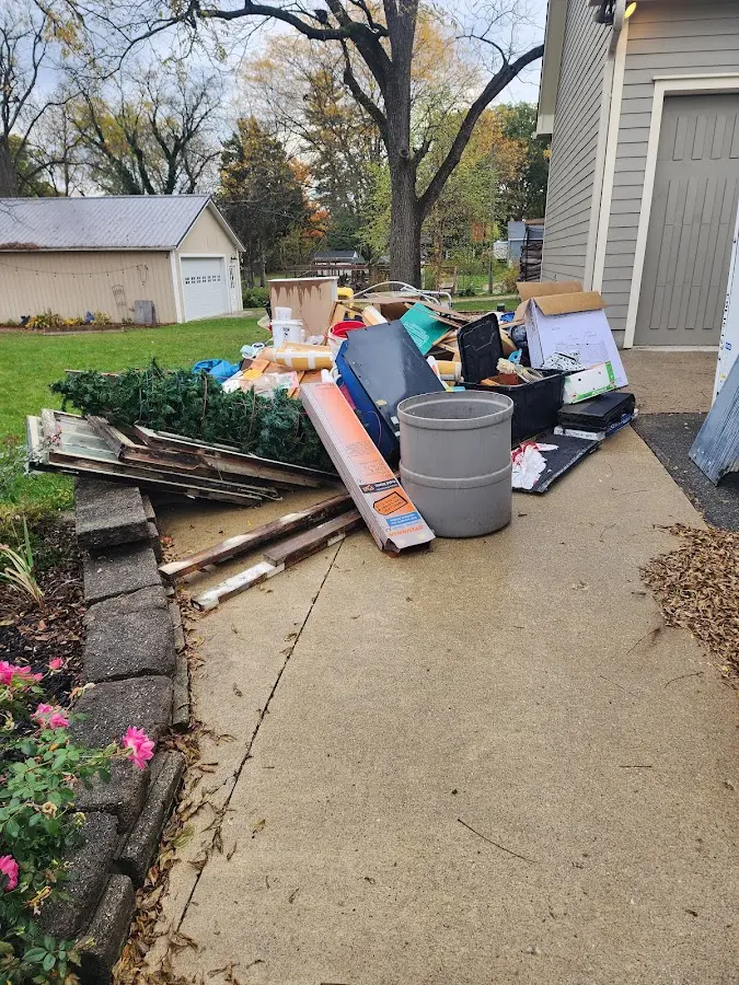 Dumpster being loaded with debris for Residential Dumpster Rental in Canby
